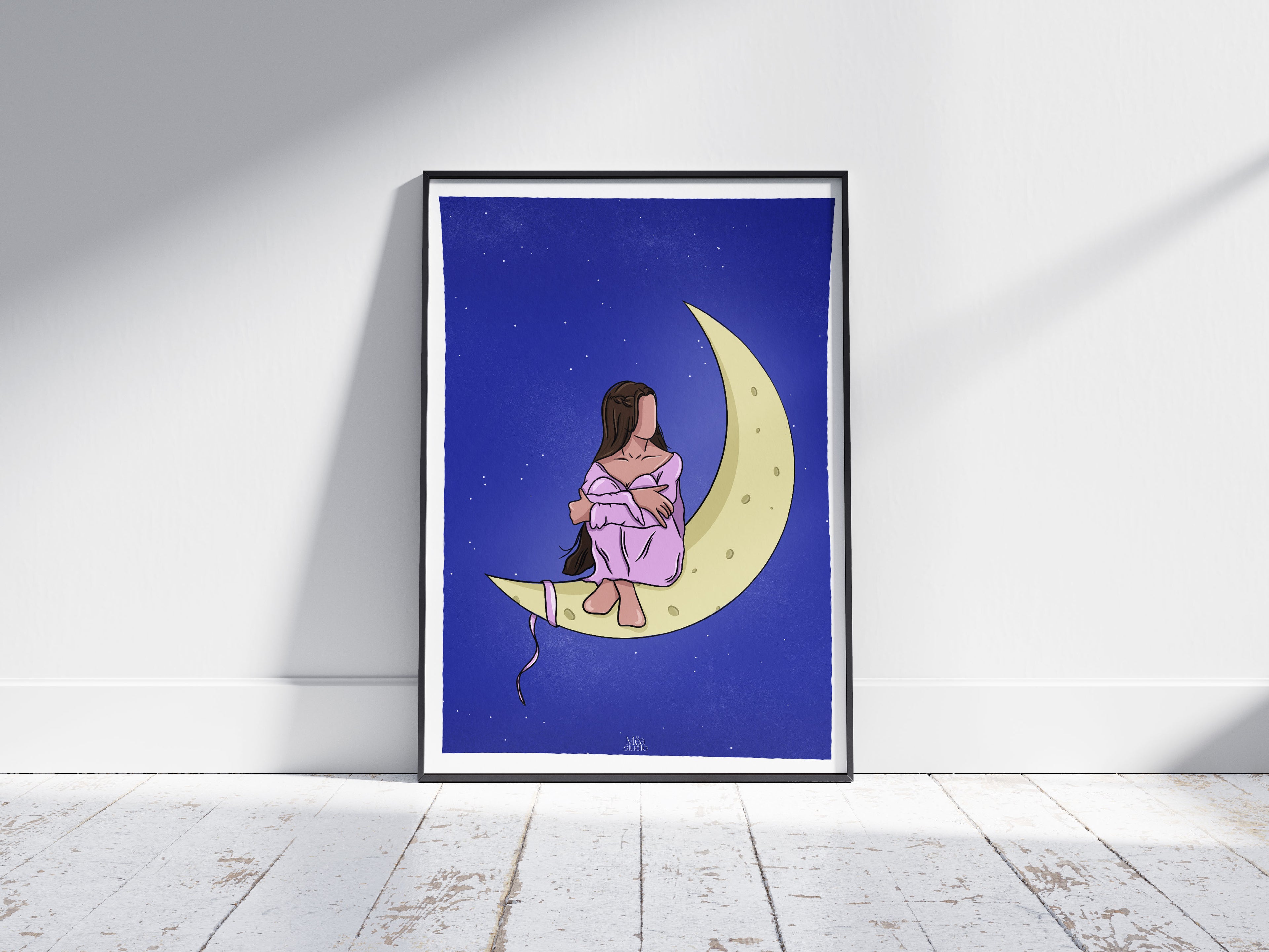 Image d’un cadre avec une illustration d’une femme assise sur la lune